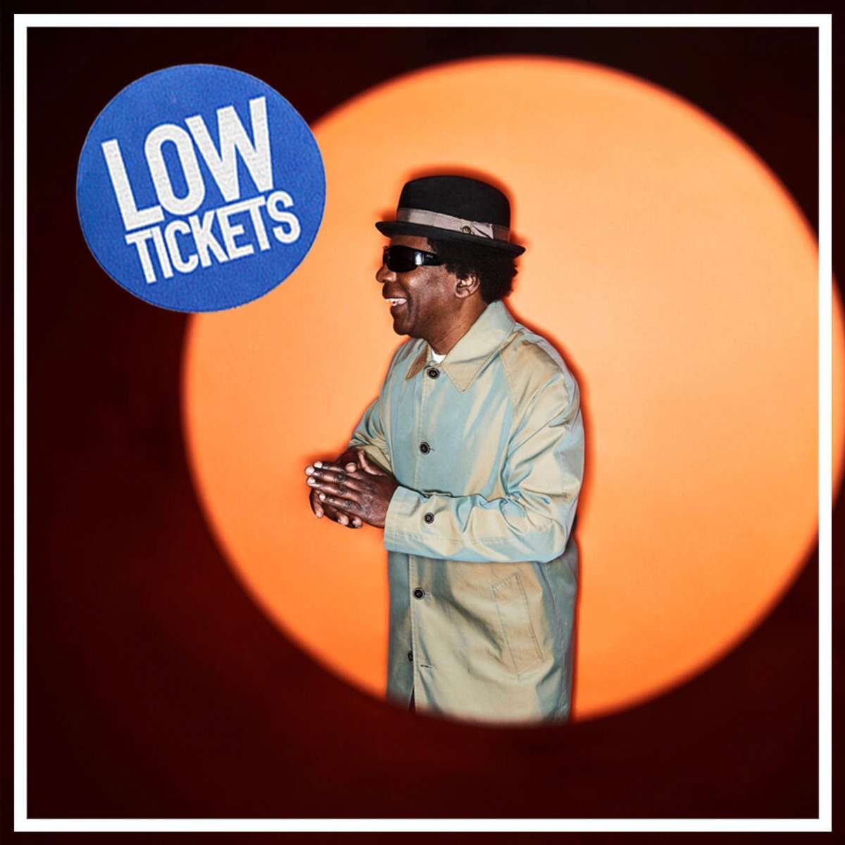 Norman Jay in a hat and sunglasses against an orange spotlight, promoting his DJ set at The Forum